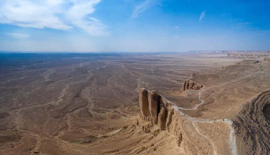 Riyadh Edge of The World and Bat Cave Visit by Bus - Sunset, open horizons, and the Dune-like atmosphere